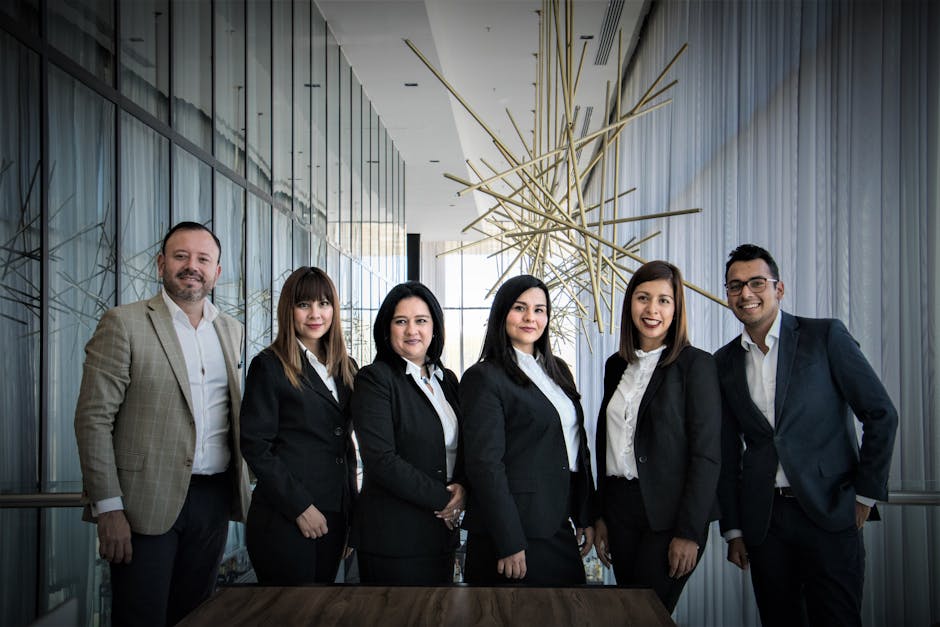 Diverse business team in formal attire posed in modern office